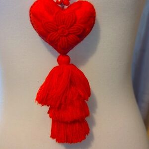 Hand made necklace w orange beads and orange embroidered heart, one of a kind.